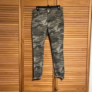 Size 8, Express, mid rise, green camouflage skinny ankle jeans.